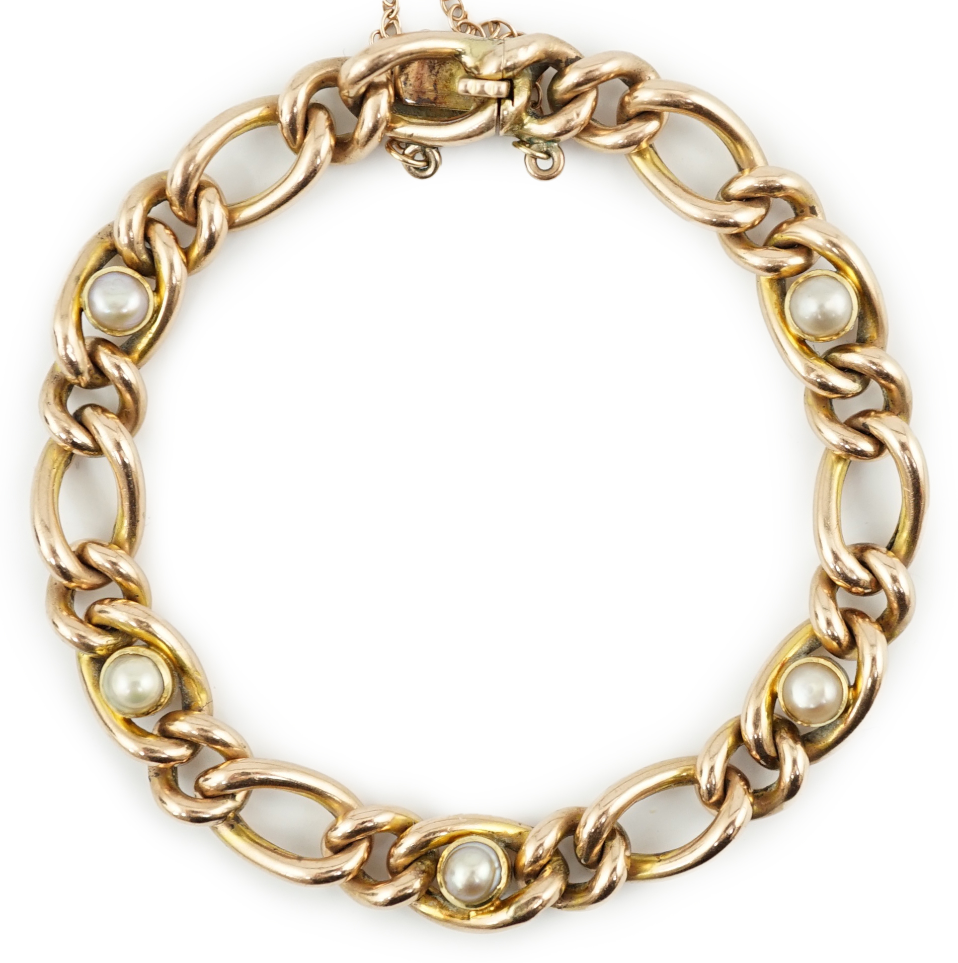 An Edwardian 9ct gold and split pearl set curb link bracelet